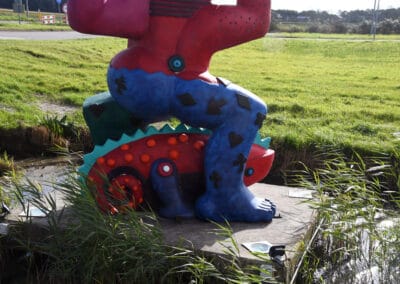 Kameleon onder beeld Tureluur Julianadorp